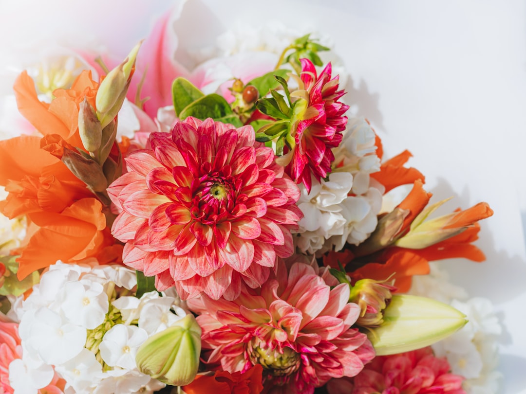 A vibrant assortment of flowers in various colors, suitable for a bouquet or delivery.